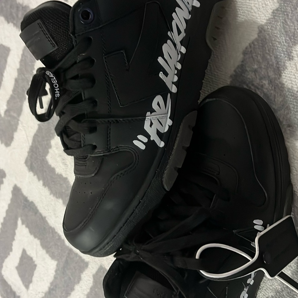 Black tennis shoes off whites